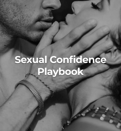 A man grasping a woman’s face in a seductive way