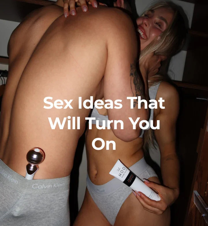 Couple holding toys and lubricant.