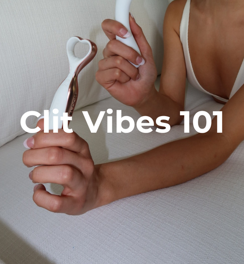 Woman holding a g spot vibrator.