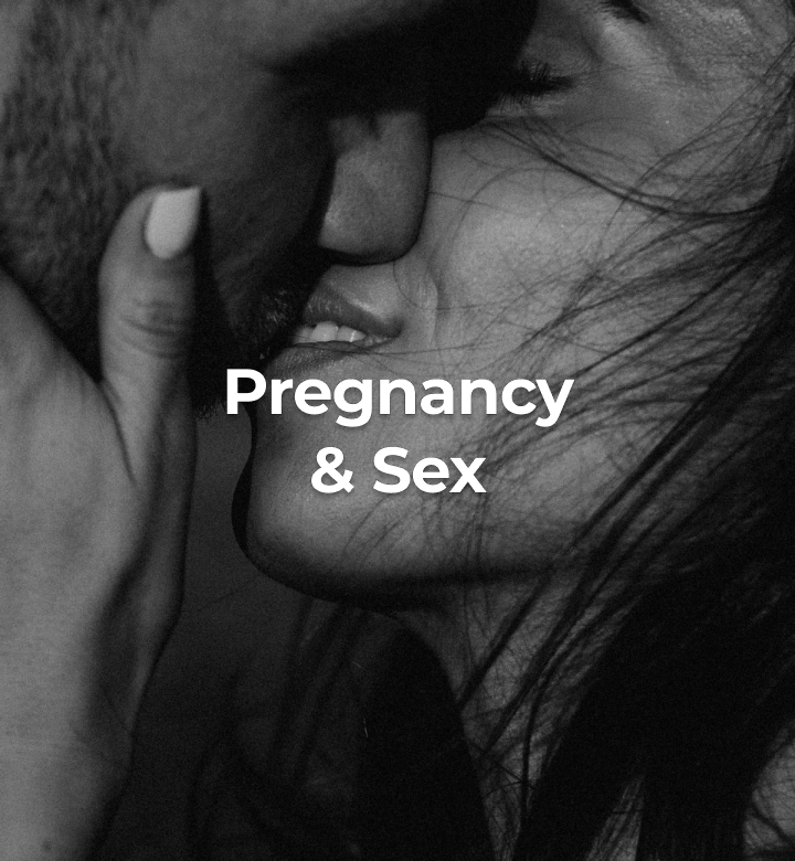 Black-and-white close-up of two people kissing