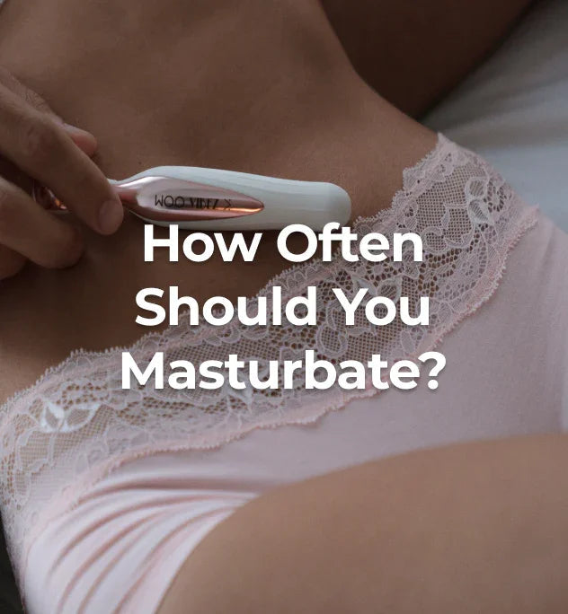 Woman wearing pink panties holding a clitoral vibrator.