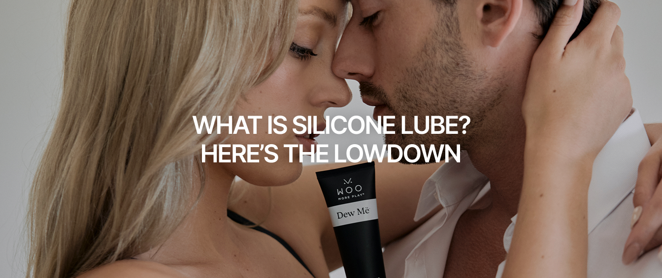 Man and woman in a close embrace, with WOO More Play Dew Më Lube in between them